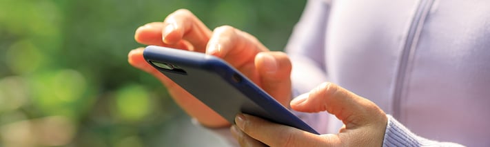 woman outdoors using a phone