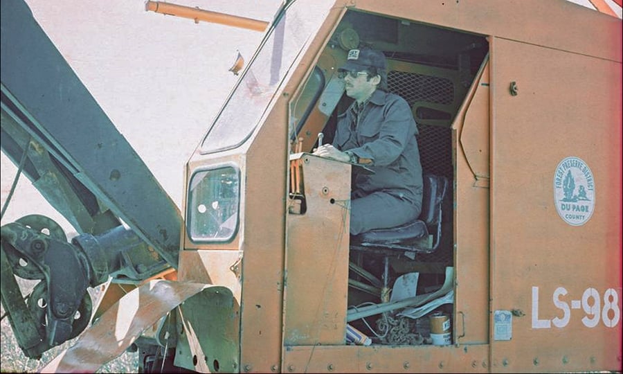 Gary Jones operates a large machine in this photograph from the 1970s.