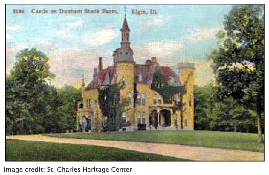 A large yellow house in a old, grainy photograph.