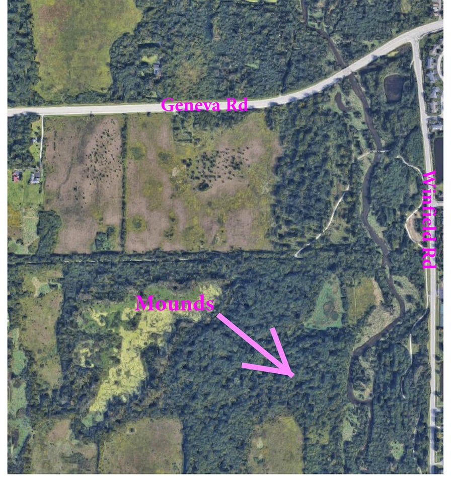 A satellite image with an arrow pointing to where the mounds are located.