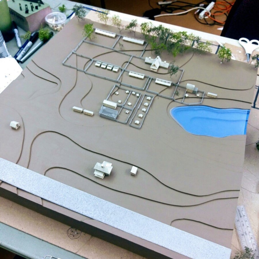 A chip board was used to build a mode of Mayslake Farms.