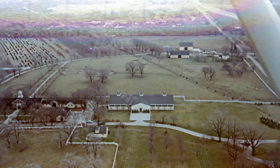 An aerial view of St. James Farm from the 1970s shows the East Farm Barn along with other buildings that are no longer standing.