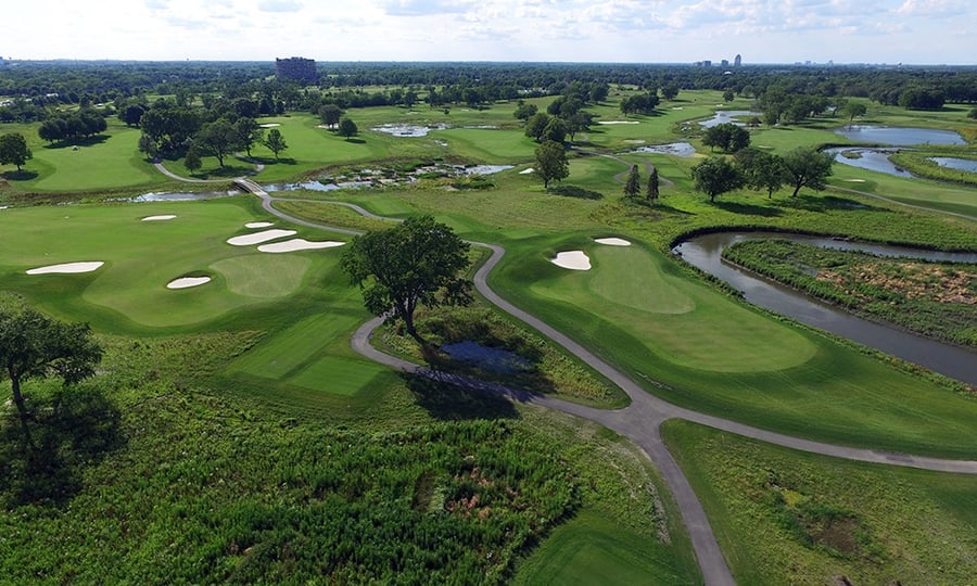 An aerial view of a lush green golf course.