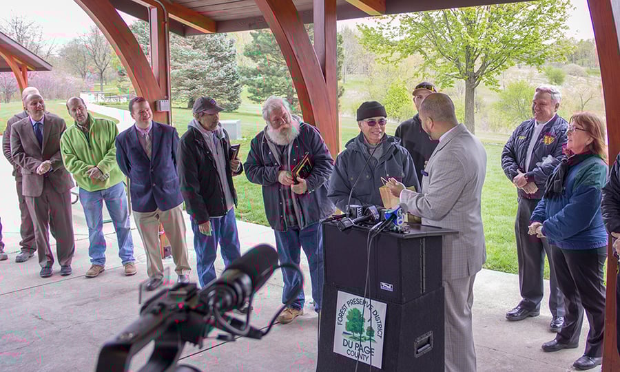 Another District official presents a gift to the man who almost drowned.
