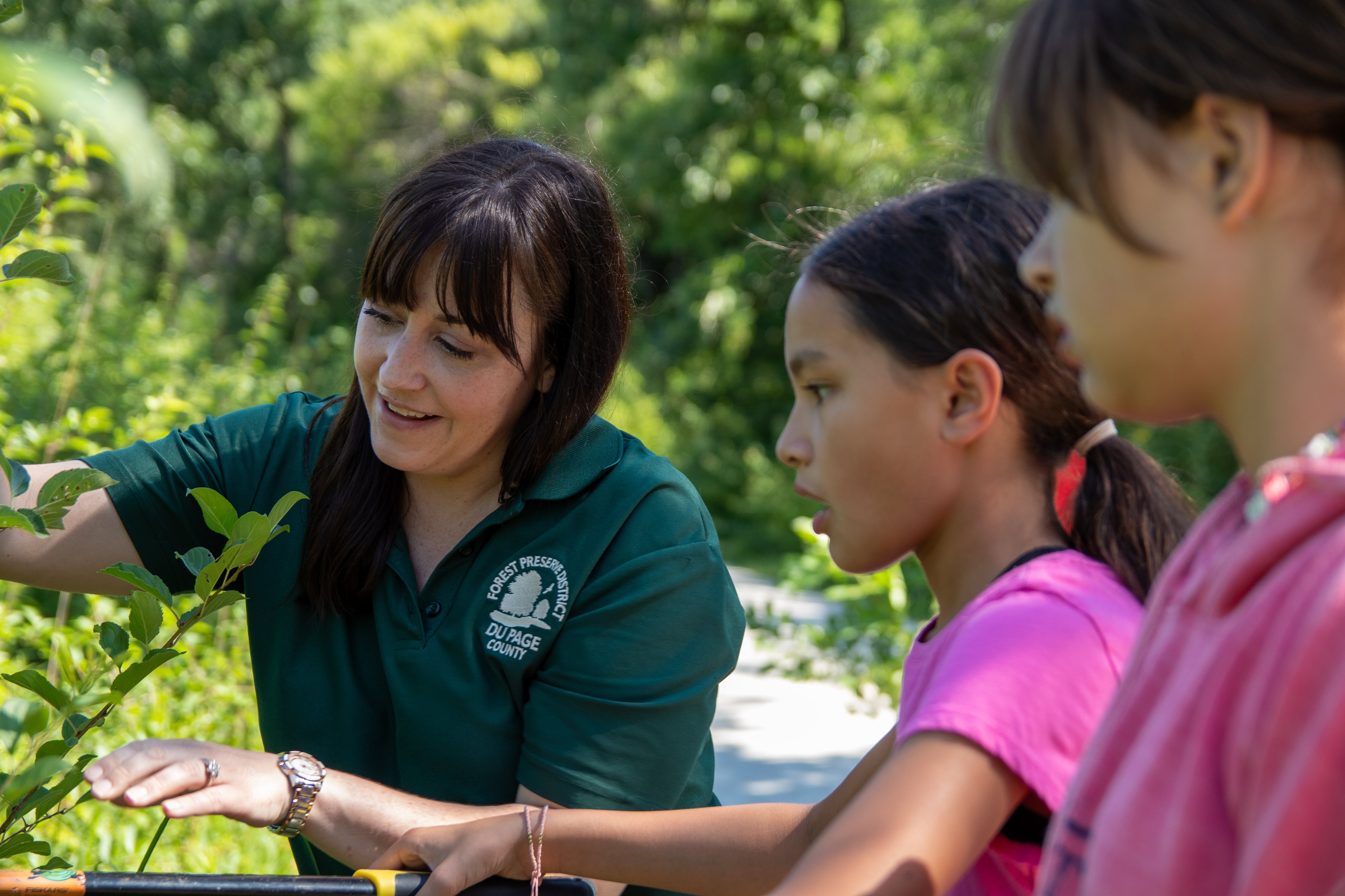 Employee teaching children