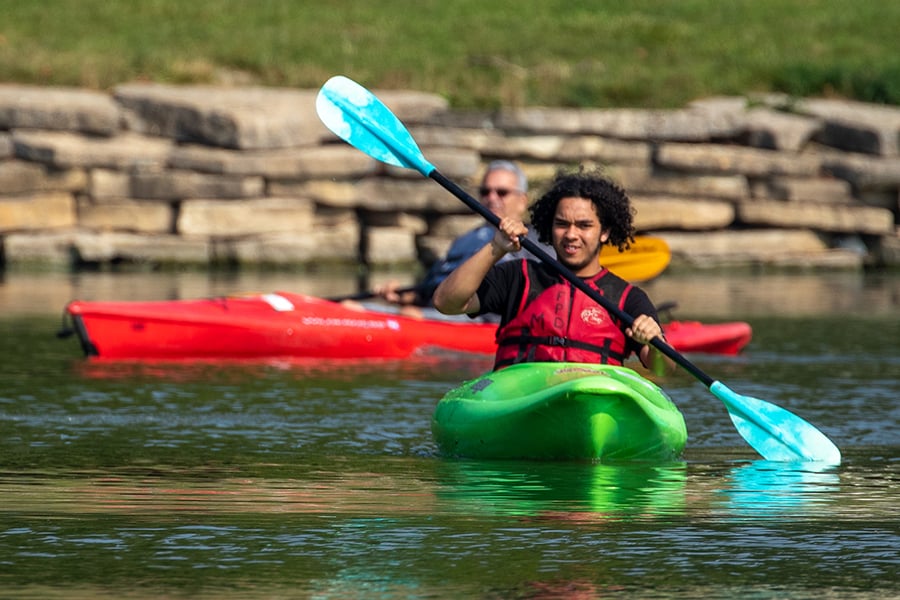 two people in two kayaks on the water at Herrick Lake two people in two kayaks on the water at Herrick Lake