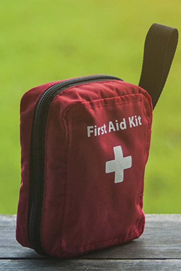 red nylon first aid kit