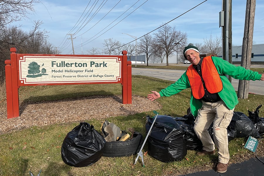 volunteer-with-bags-of-trash