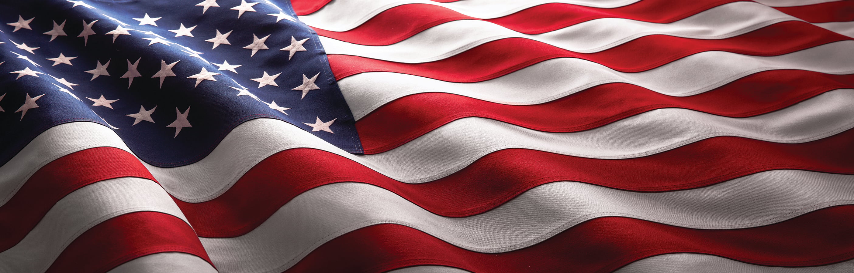 An American flag blows in the wind.